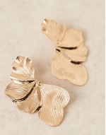 stud earrings with oversized floral petal detail in gold tone