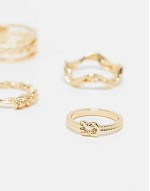 pack of 4 rings with knot design in gold tone